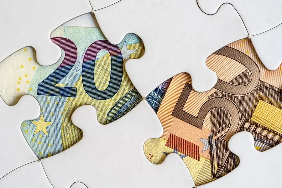 Euro banknotes creatively displayed within a jigsaw puzzle theme.