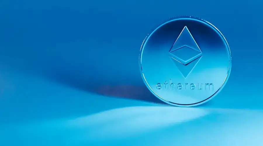 A minimalist image of an Ethereum coin on a blue background, highlighting modern finance.