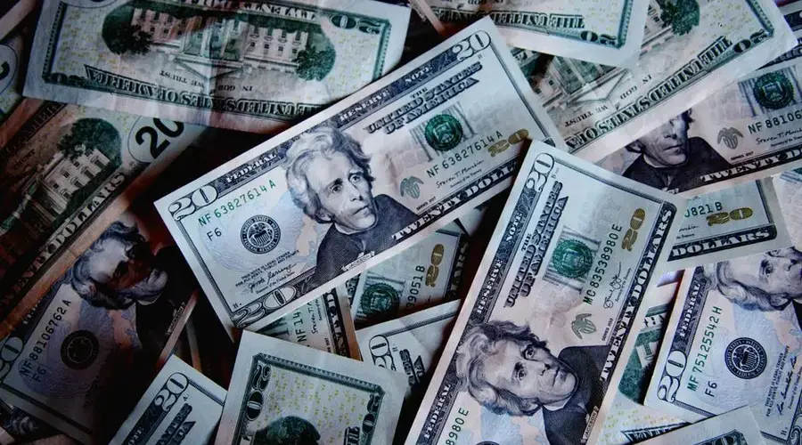 A stack of US dollar bills symbolizing wealth, finance, and abundance.