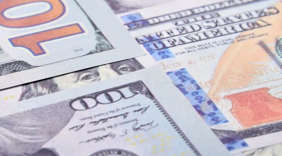 Detailed close-up of US dollar banknotes, showcasing currency design in Berlin.