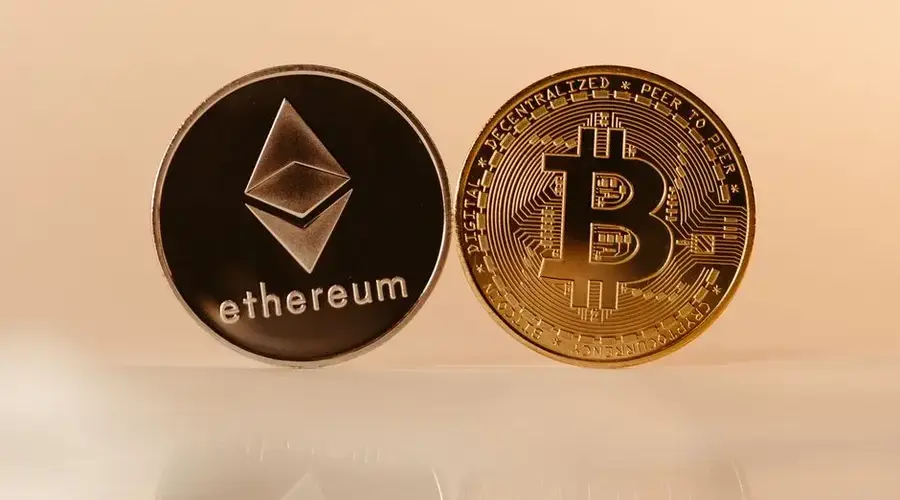 Close-up of Ethereum and Bitcoin coins representing modern digital currency and blockchain technology.