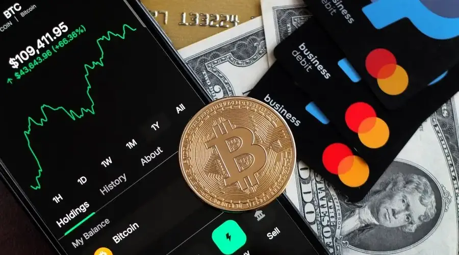 A visual representation of Bitcoin trading and financial transactions with credit cards and cash.