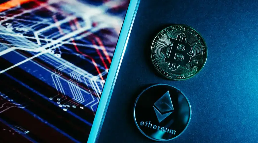 Bitcoin and Ethereum coins on a digital circuitry background symbolizing blockchain technology.