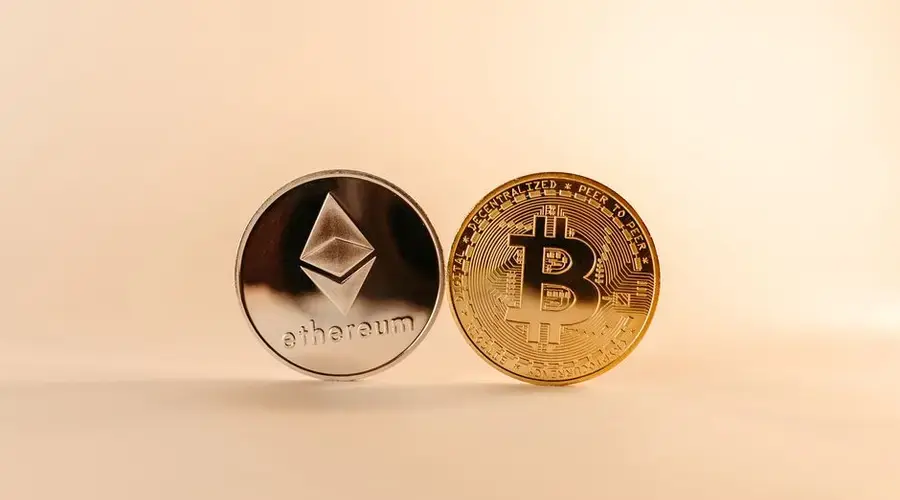 Close-up of Bitcoin and Ethereum coins symbolizing digital currency and blockchain technology.