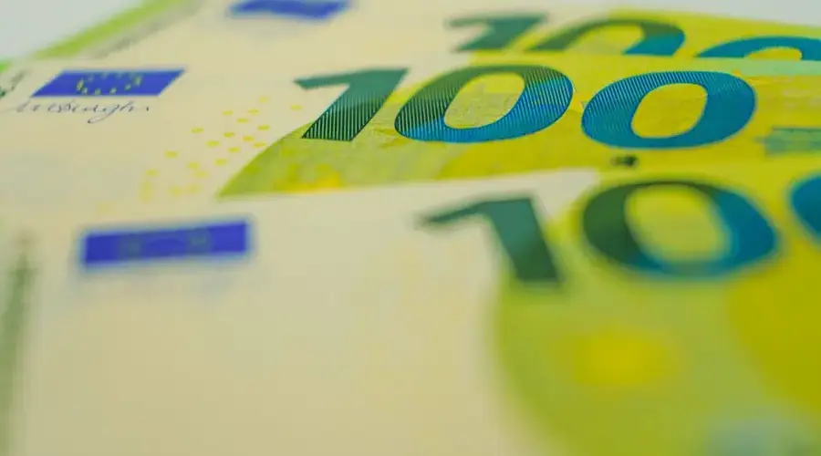 Euro banknotes in close-up with focus on 100 denomination. Perfect for financial themes.