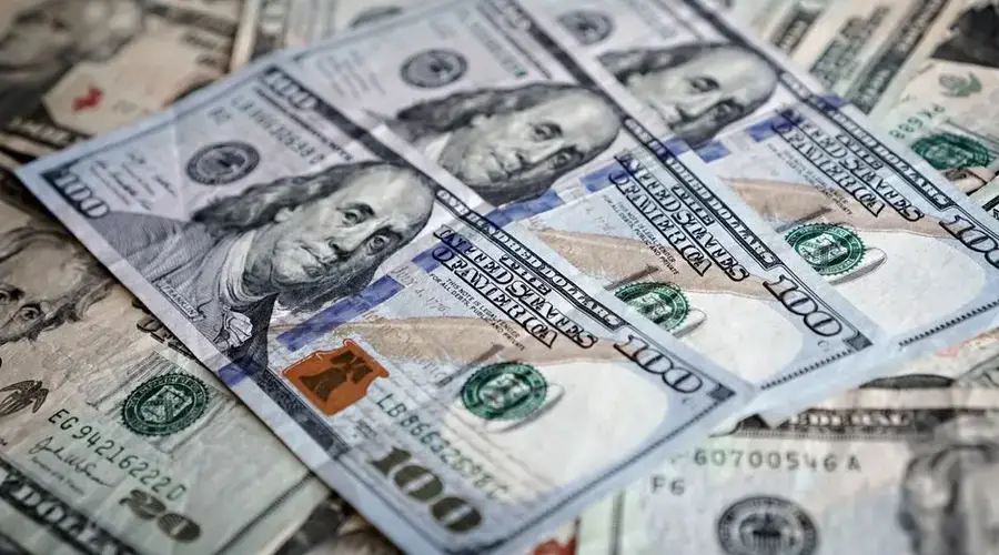 Close-up of various US dollar bills highlighting finance and economy.