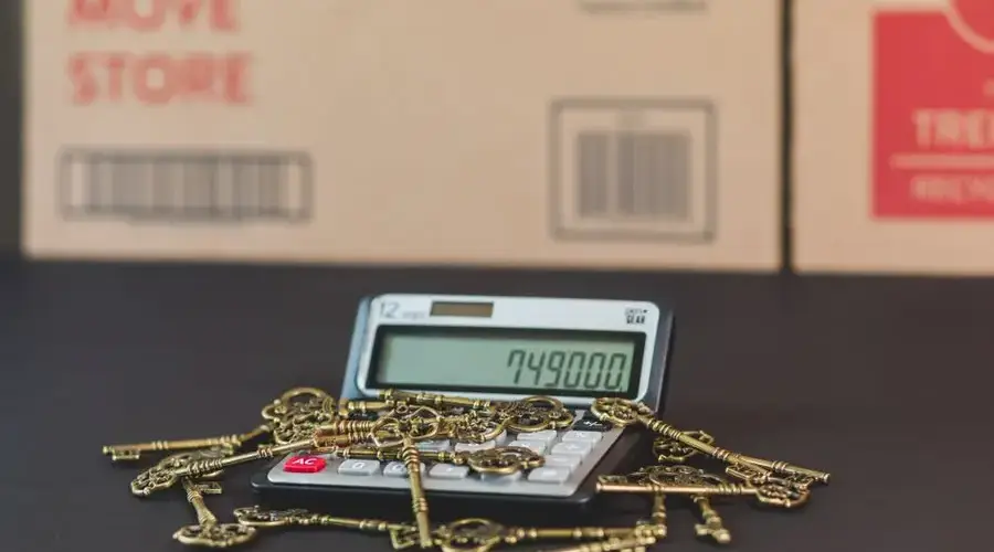 A calculator with vintage keys symbolizes real estate investment and mortgage calculations.