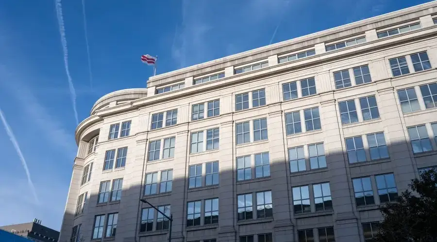Elegant office building under a clear blue sky in Washington, D.C.