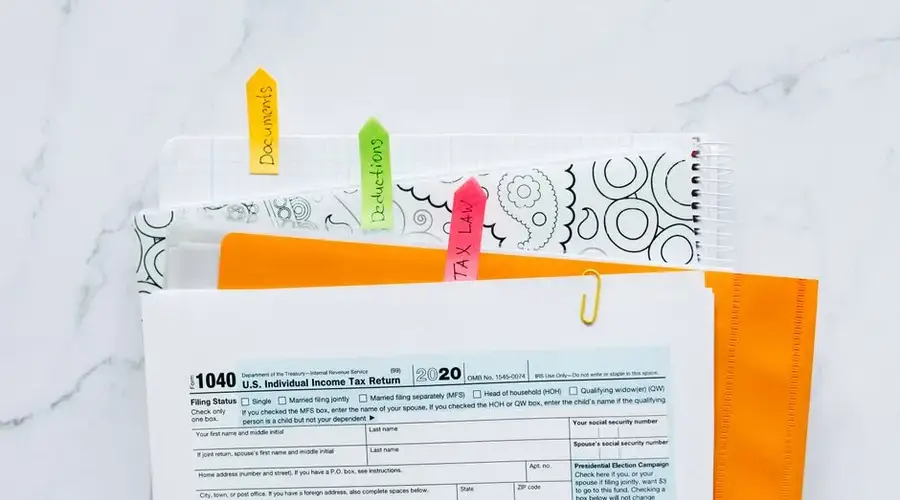 Colorful tabs organizing tax documents for easy filing and reference.