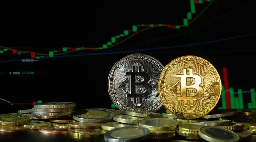 Bitcoin coins in front of a rising financial graph, symbolizing market growth and investment potential.