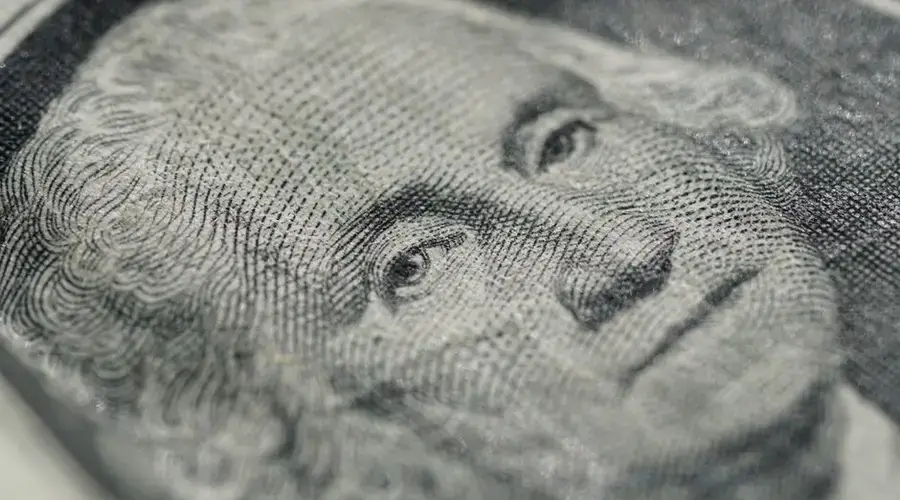 Detailed macro shot of a U.S. dollar bill showing intricate texture and design features.