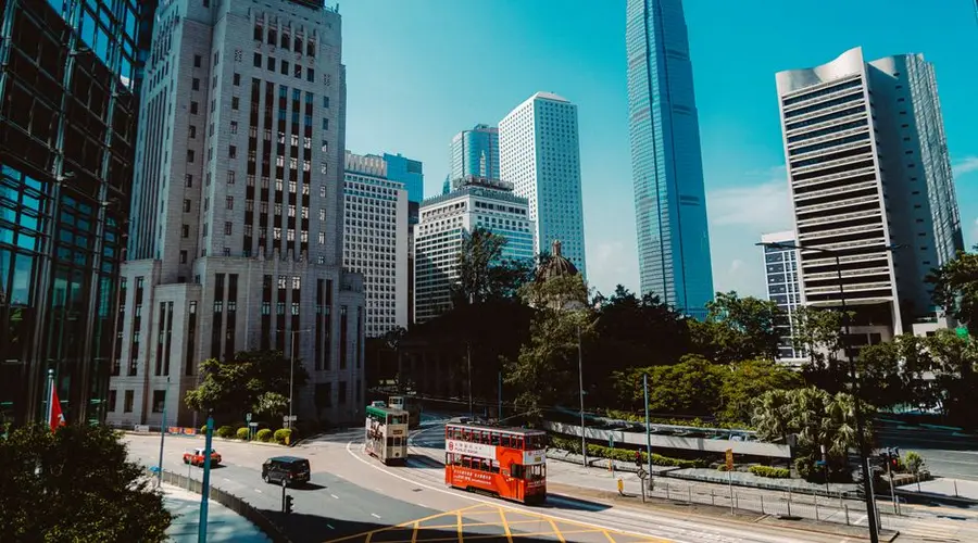 A vibrant view of Hong Kong's Central District showcasing iconic skyscrapers and city life.