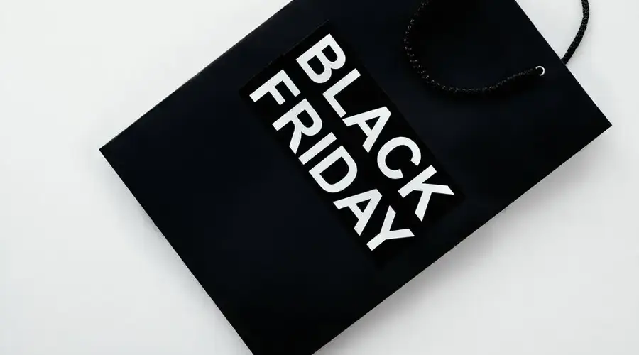 Black Friday shopping bag on a plain background for retail sales and discounts advertising.