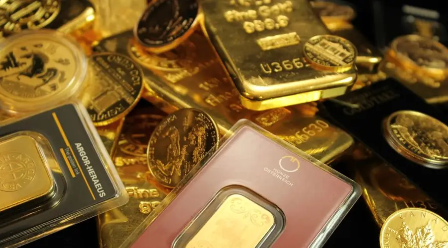 Detailed close-up of gold bars and coins symbolizing wealth and investment opportunities.