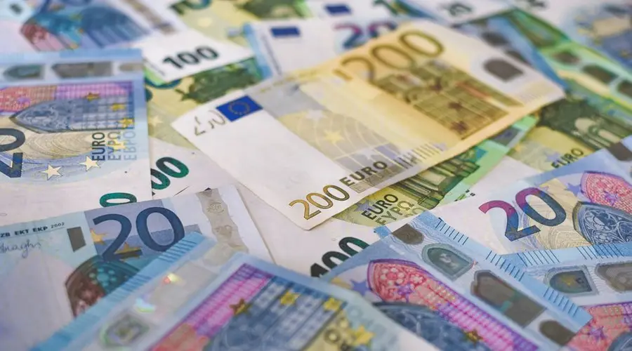 Close-up of Euro banknotes in different denominations, symbolizing wealth and finance.