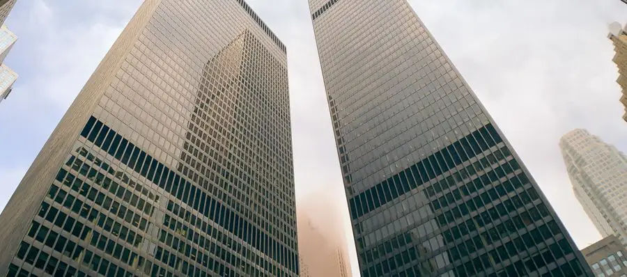 Toronto skyscrapers against a cloudy sky, showcasing urban architecture.