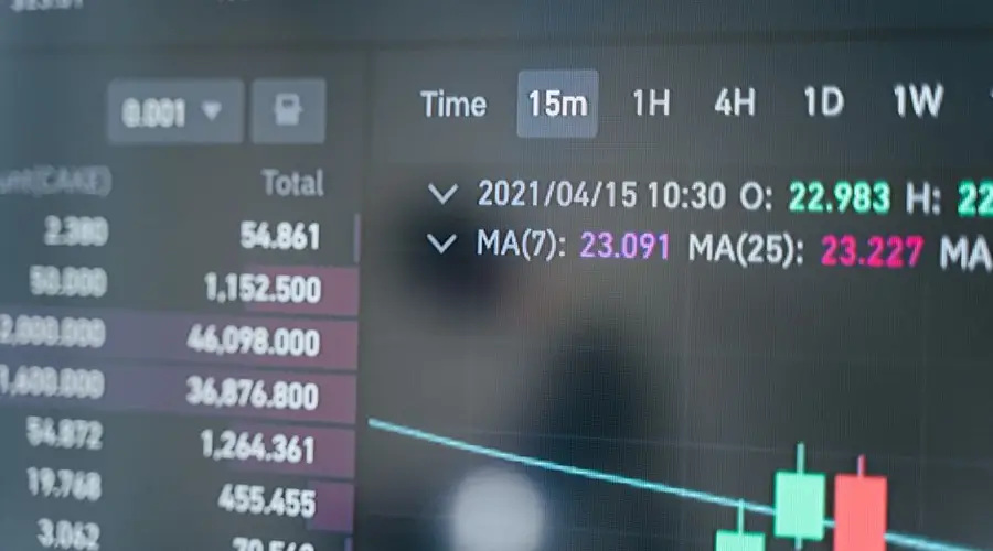 Close-up of a cryptocurrency trading screen displaying real-time data, graphs, and analytics.