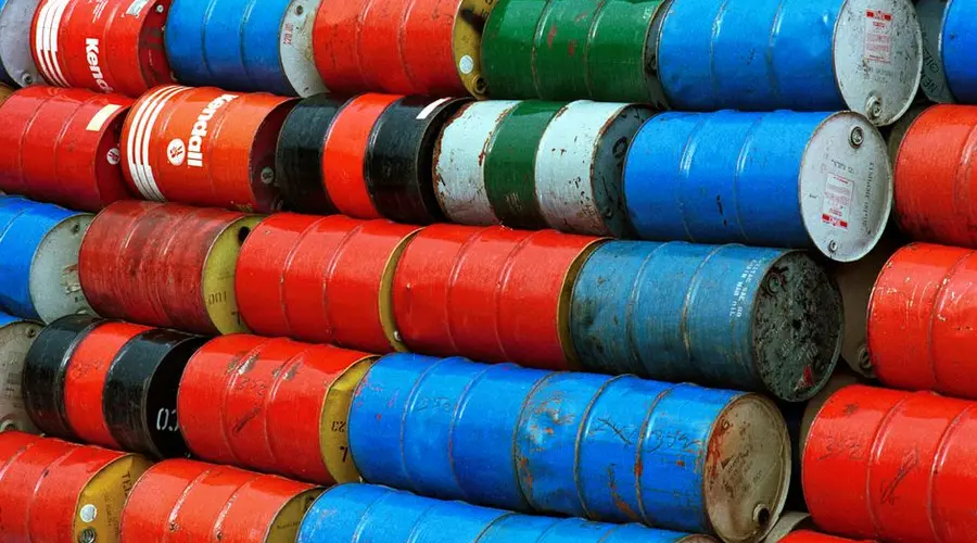 Vibrant stack of colorful industrial barrels, ideal for environmental or industrial themed projects.