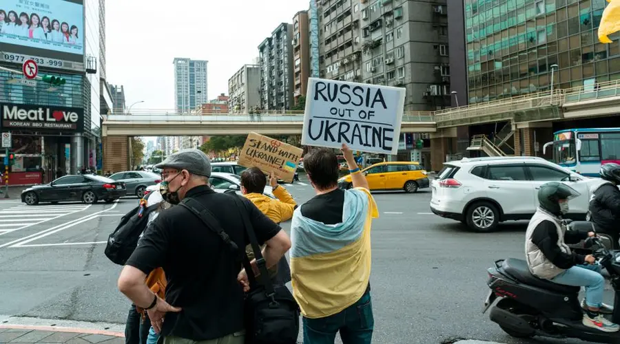 Protesters in the city holding signs against Russia's actions in Ukraine.