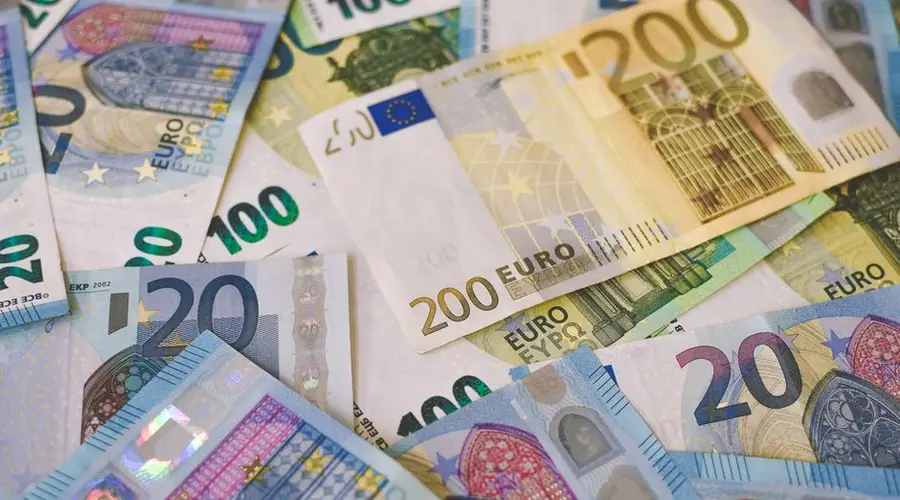 Image of various Euro banknotes spread out, captured in Berlin.