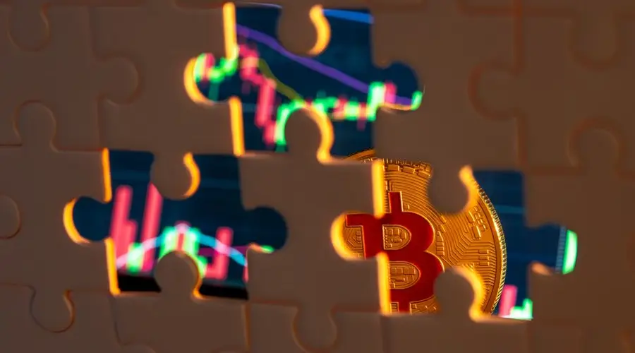 A bitcoin coin revealed through puzzle pieces with financial graphs in the backdrop.