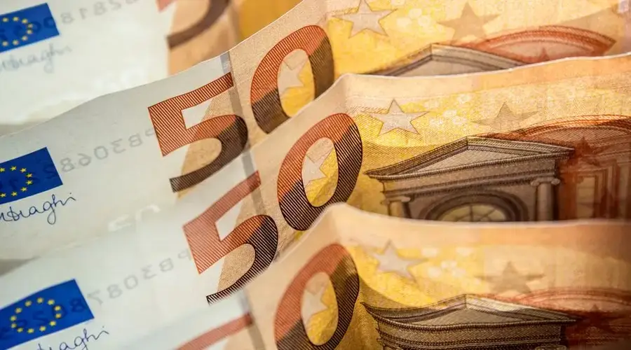Detailed shot of fifty euro bills highlighting European currency and finance concept.