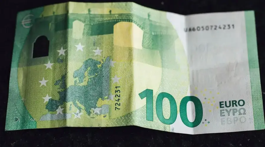 Close-up image of a 100 Euro banknote highlighting its design and details.