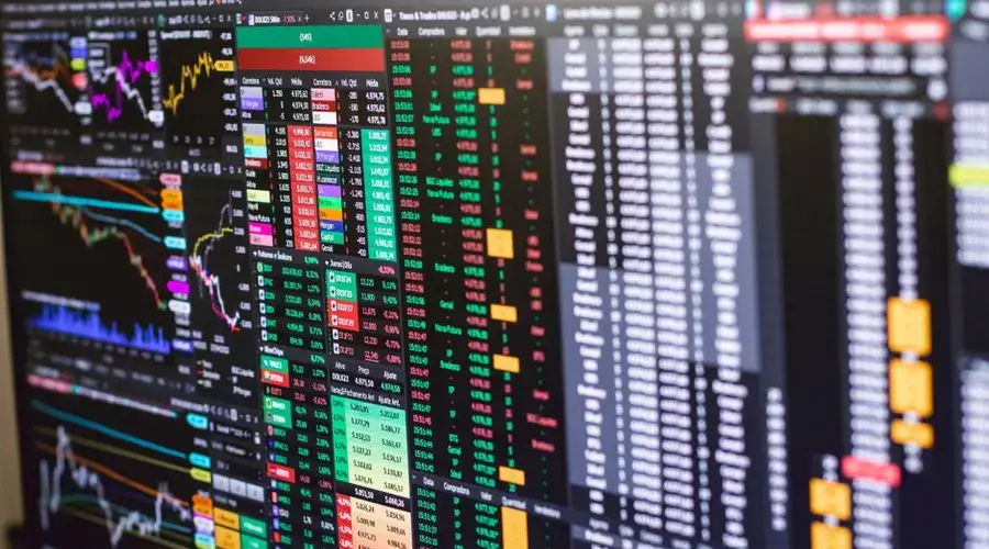 Detailed financial trading screen with colorful charts and data representing market fluctuations.