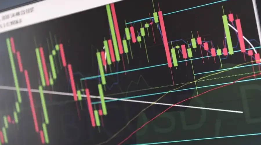 Close-up of vibrant stock market graphs displaying trading trends on a monitor, ideal for finance and cryptocurrency concepts.