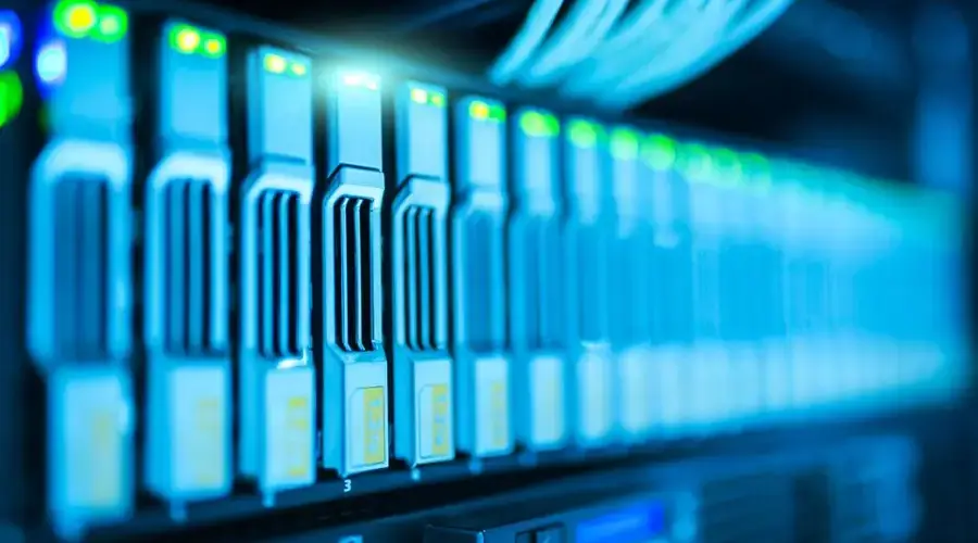 Detailed image of a server rack with glowing lights in a modern data center.