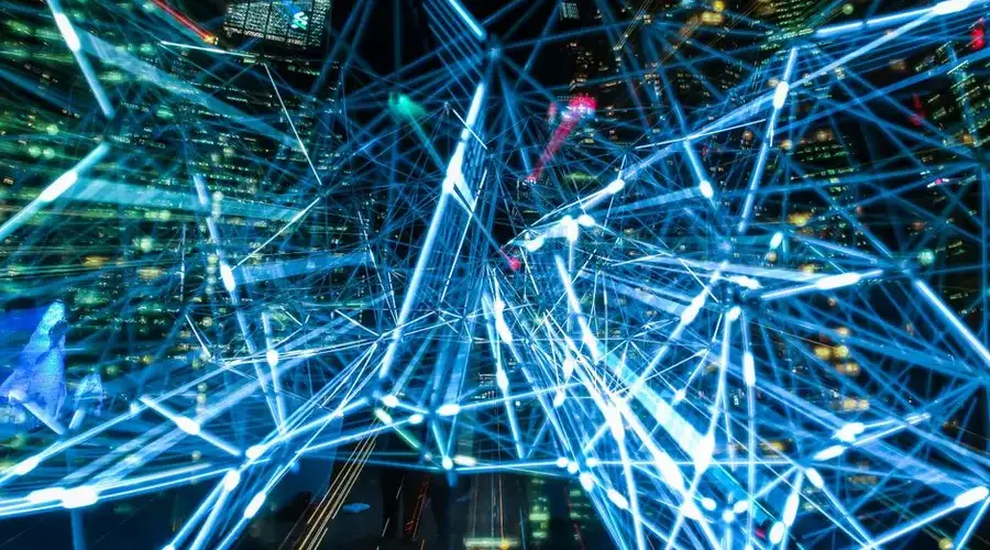 Dynamic urban scene showcasing interconnected light trails representing digital communication networks.