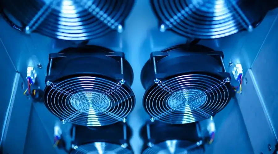 Close-up of cooling fans in a server room, showcasing technology and efficiency.