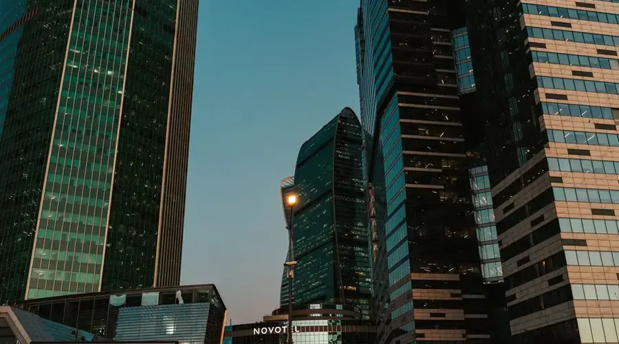 Stunning view of modern skyscrapers in an urban downtown area at dusk.