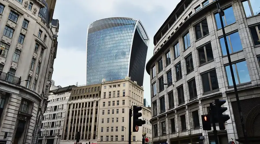 Futuristic skyscraper architecture in a bustling urban city setting.