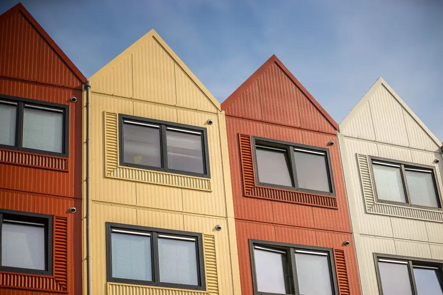 Vibrant apartment facades with distinct designs and colors.