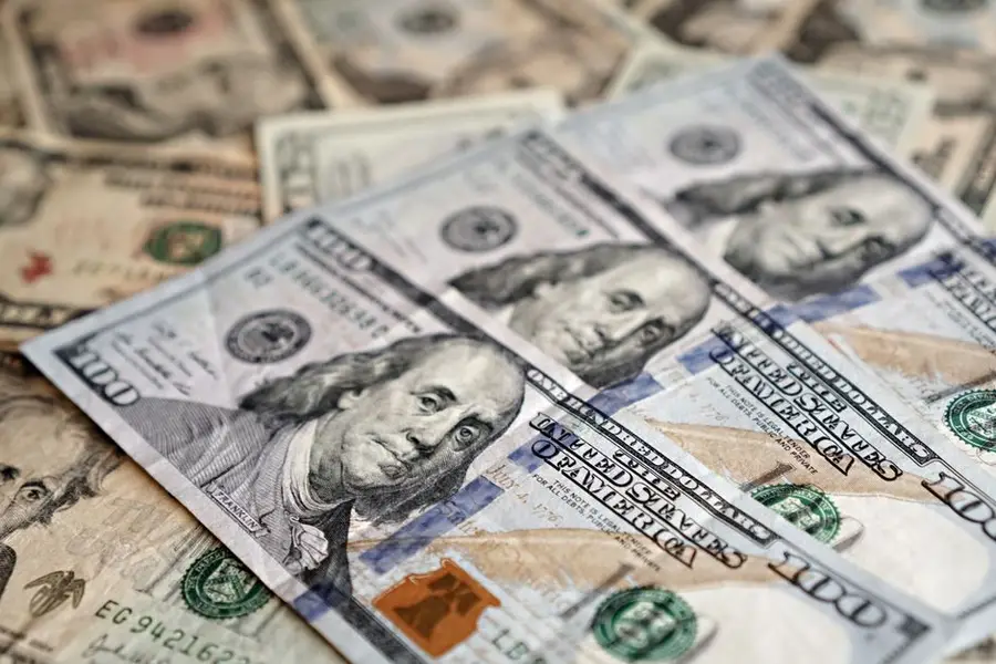 A stack of US dollar bills representing wealth, investment, and economic concepts.