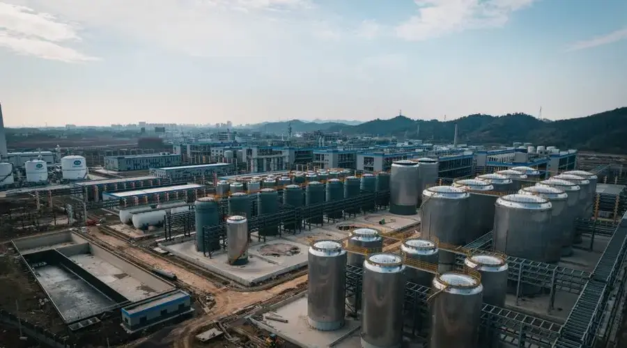 Expansive aerial view of an industrial complex with storage tanks, located in China.