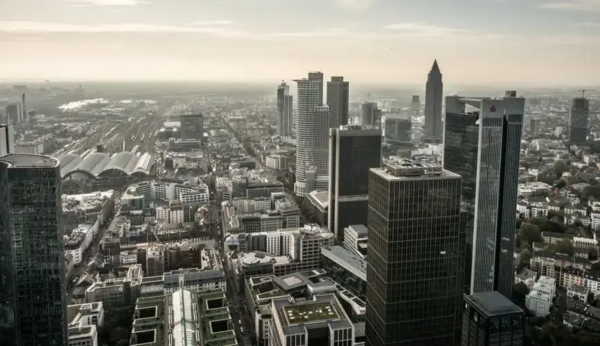 Aerial view of Frankfurt's modern skyline with skyscrapers and urban landscape.