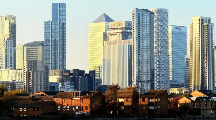 Captivating view of Canary Wharf's iconic skyline at sunset in London, United Kingdom.
