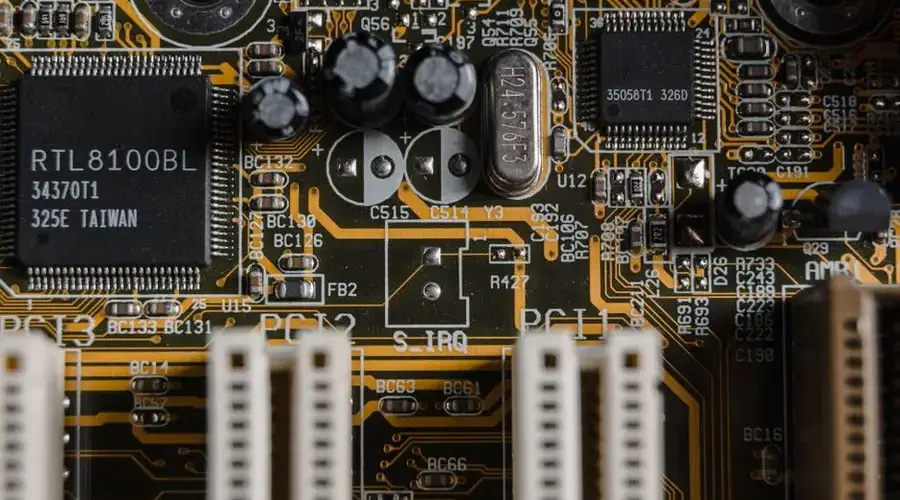 Detailed view of a motherboard with visible microchips and circuits.