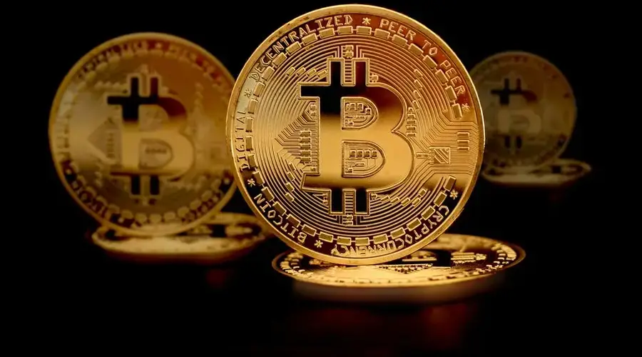 Close-up of golden Bitcoin coins symbolizing digital currency and modern finance.