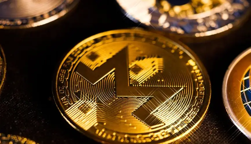 Shiny gold Monero coin close-up, focusing on digital currency aesthetics and investment potential.