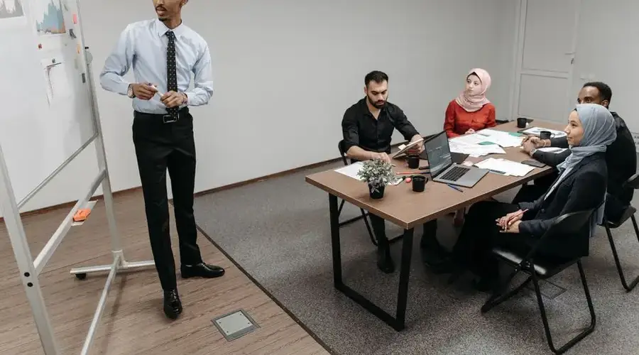 A diverse group of professionals collaborating in a modern office meeting.