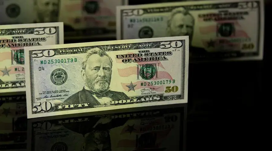 Crisp 50 dollar bill with reflection, offering a detailed view perfect for financial themes.