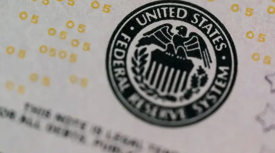 From above eagle on antique column in circle on banknote of Unites States placed on table