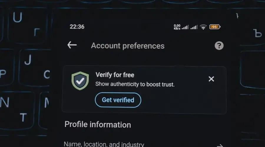 Close-up of a smartphone screen displaying account verification alert. Ideal for security and authenticity themes.