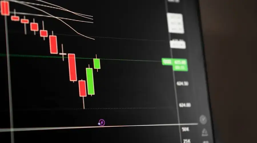 Candlestick chart showing a downward trend in the stock market analysis.