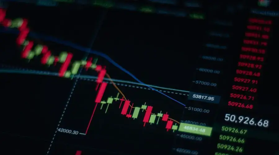 Close-up of stock market chart showing trends and data on a digital screen.