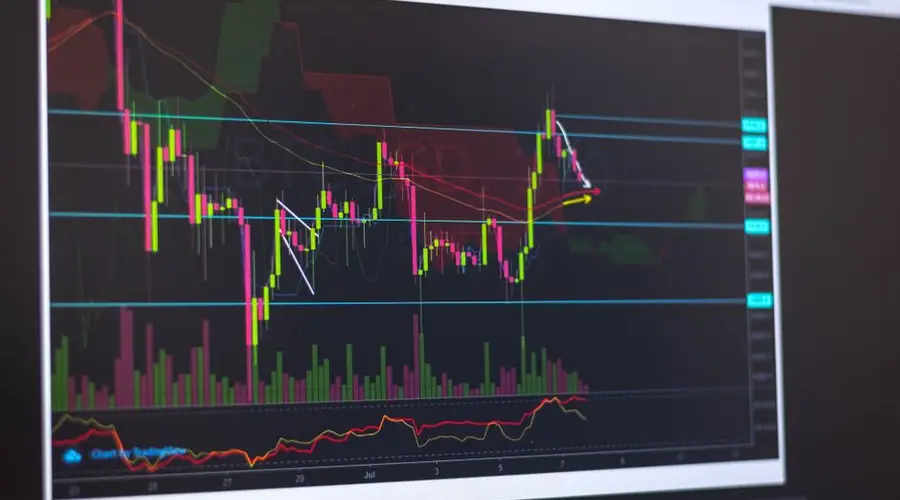 Close-up of a computer screen displaying cryptocurrency market trends and trading data.