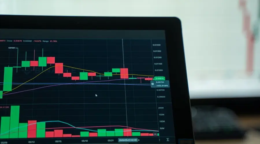 Cryptocurrency analysis on a digital screen with candlestick charts showing market trends and volatility.